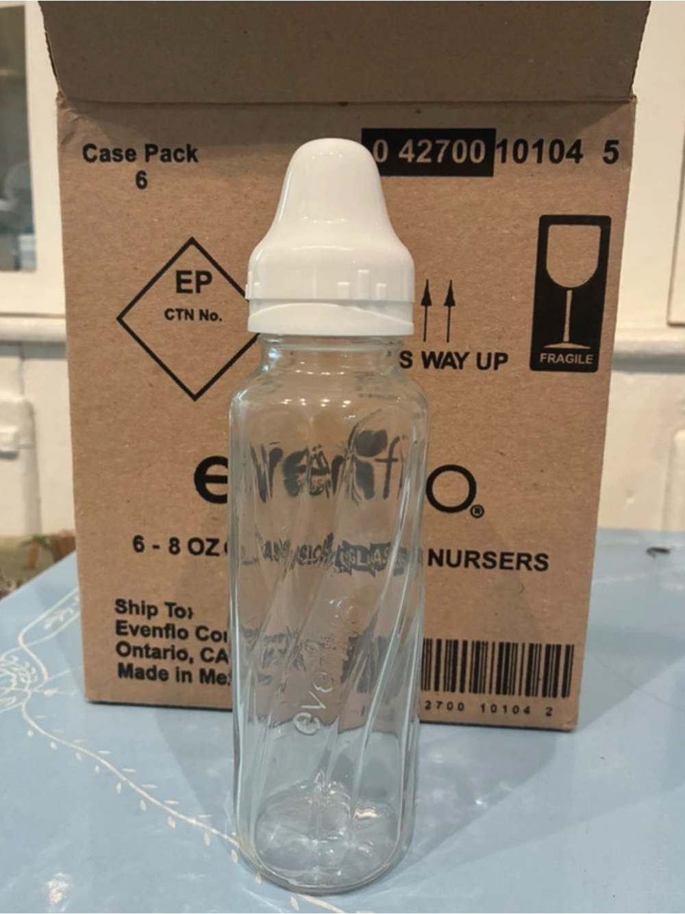 Evenflo Clear Glass Baby Bottle with White Nipple Cap